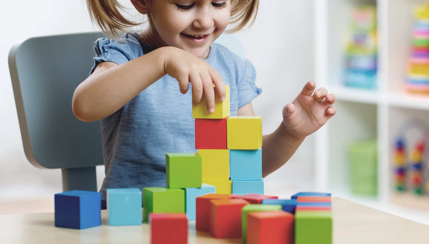 little girl playing with blocks