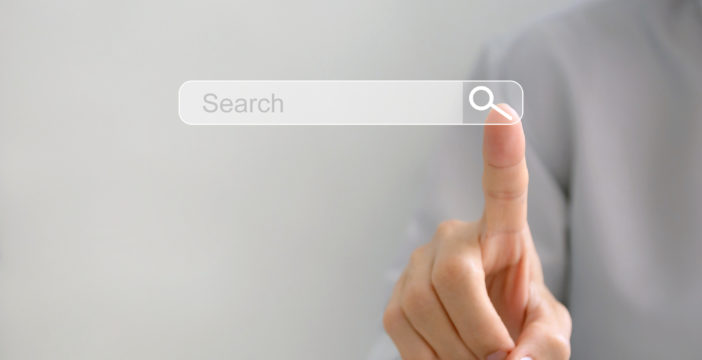 human finger pointing to the Search Icon