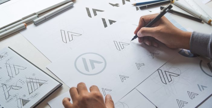 a designer working on a logo