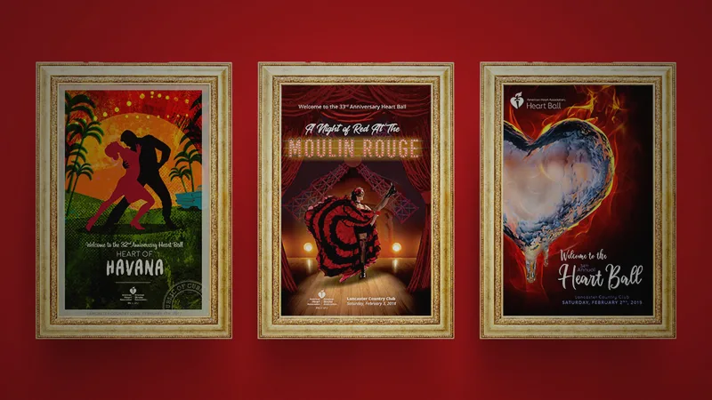 three posters hanging on a red wall