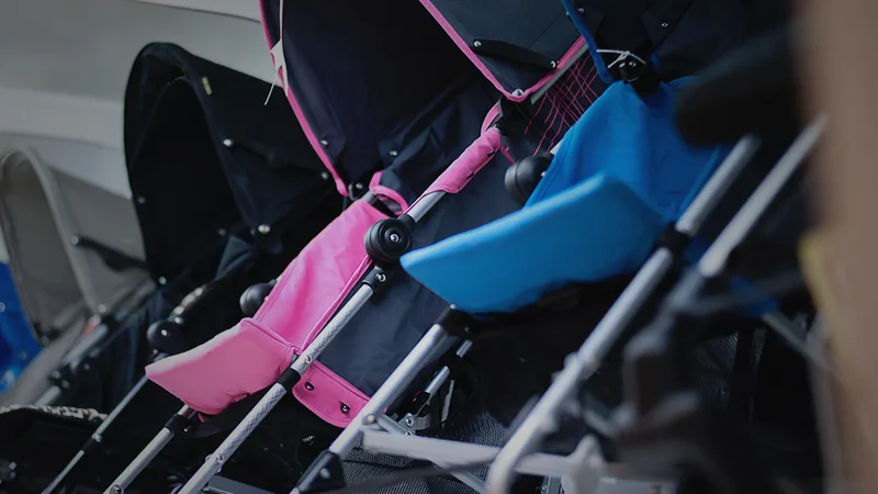 pink and blue baby strollers