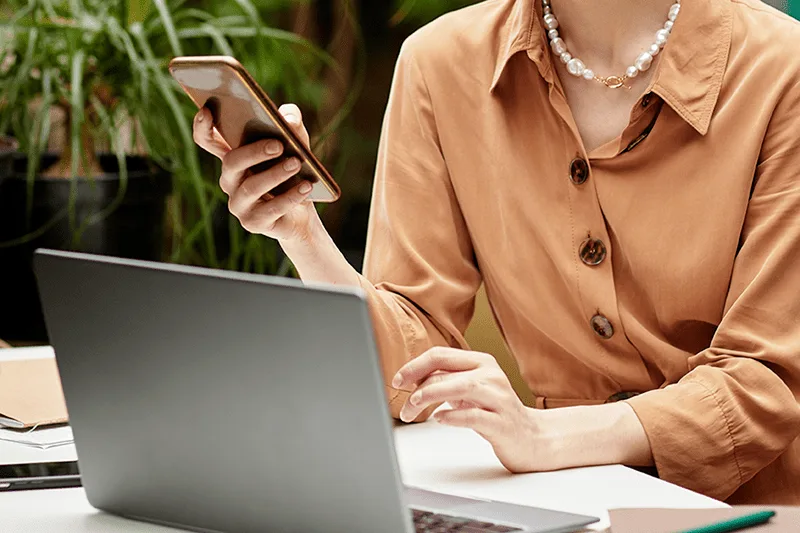 WomanLookingAtPhone SizeReduced 4 Personalized Email Marketing Tactics to Boost Engagement