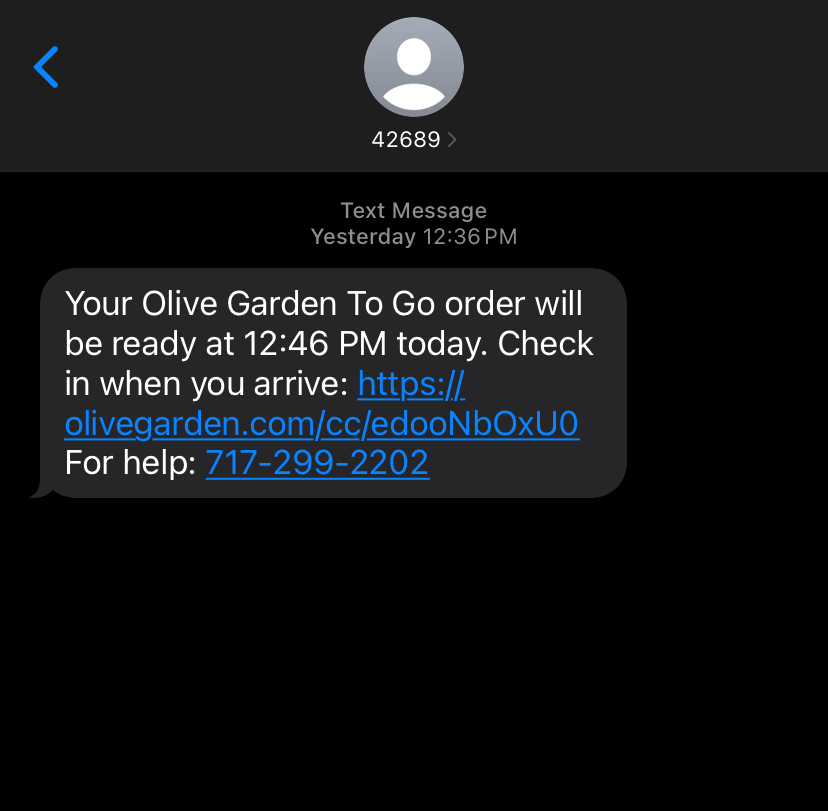 A screenshot of a text from Olive Garden saying your to go order will be ready later today.