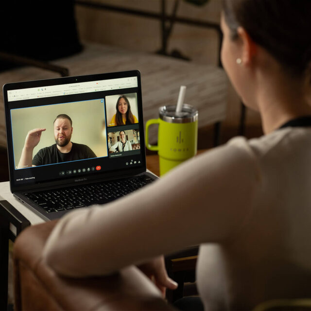 Tower Marketing employees having a web design meeting with some employees working from home