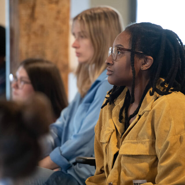 Group of Tower Marketing employees listening to a presentation during quarterly training days