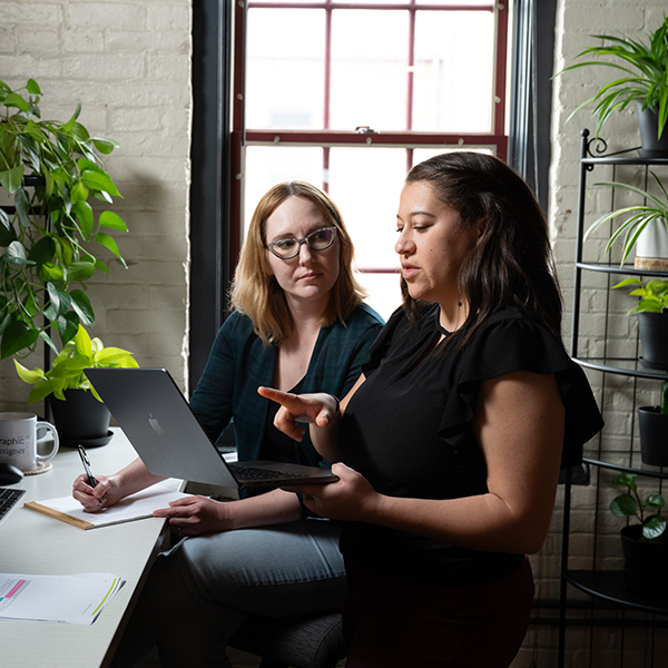 Tower Marketing's digital marketing strategy consultants strategizing a comprehensive marketing plan in the Tower Marketing office.