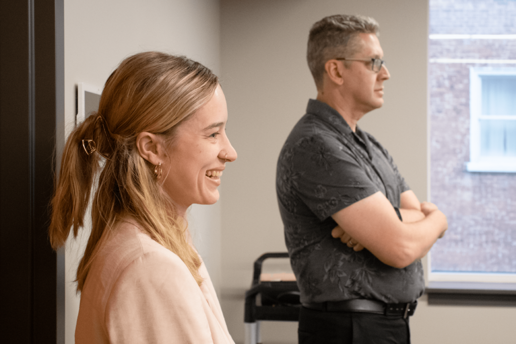 Tower Marketing business developers are looking at an SEO vs. PPC presentation.