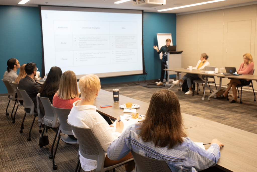 Tower SEM specialist giving a presentation about SEO and PPC to a class.