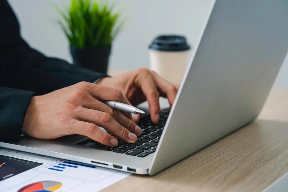 A personi searches 'why use wordpress' on a laptop.