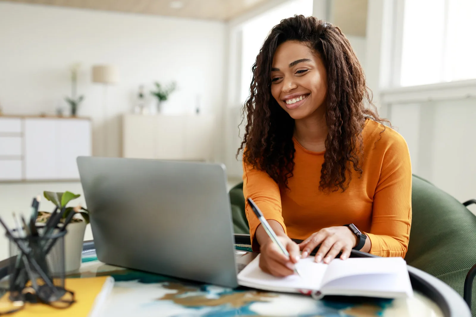 A woman using a checklist to ensure her email follows all laws and best practices.